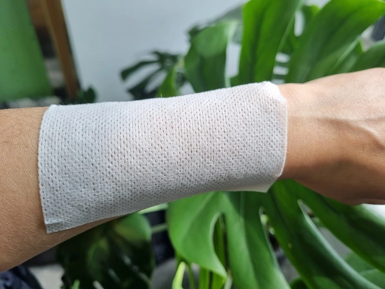 Non woven dressing roll applied on skin for wound dressing fixation Non woven dressing roll applied on skin for wound dressing fixation